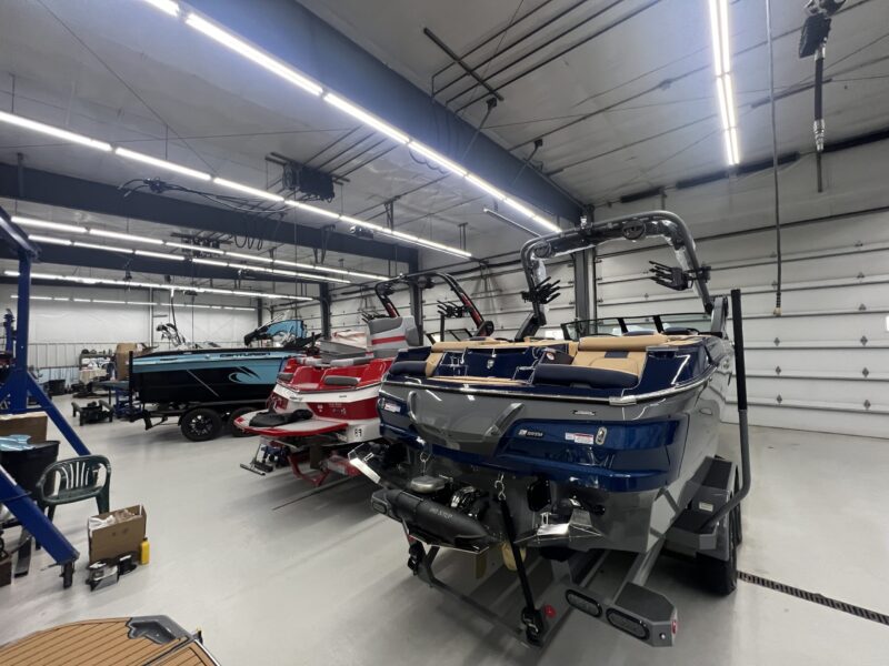 a row of boats in a garage
