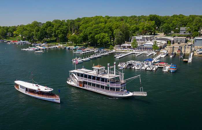 boat docks with ferry in front of gage marine building